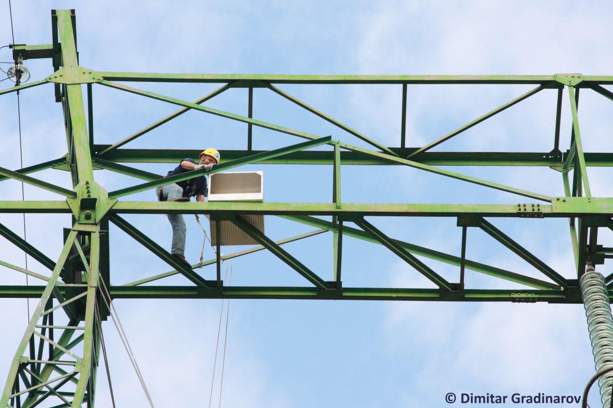 Artificial nest box installation on the power lines construction