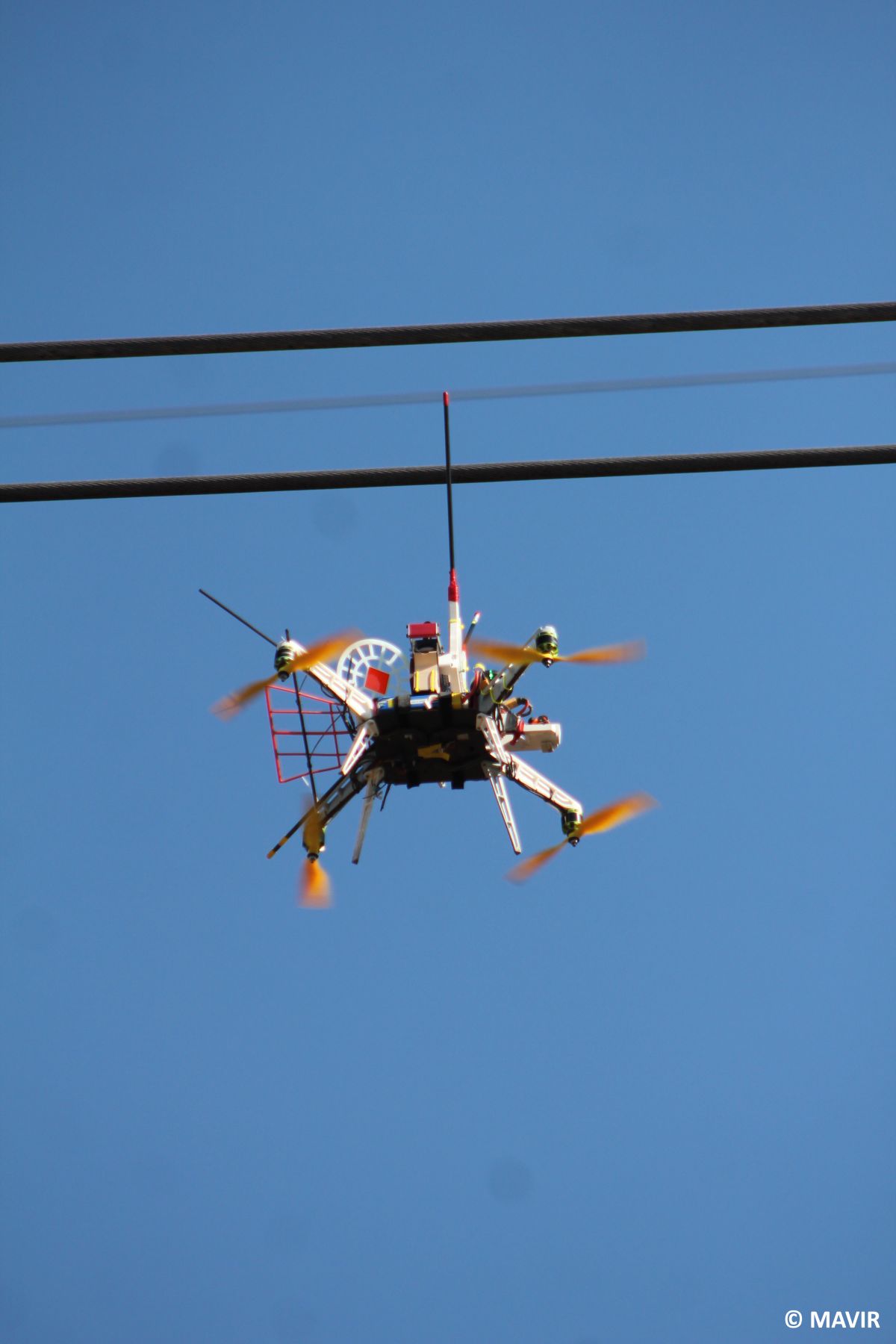 Drone installing the flight diverters on the power lines